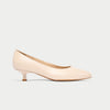 Nude-colored kitten heel shoe on a light gray background