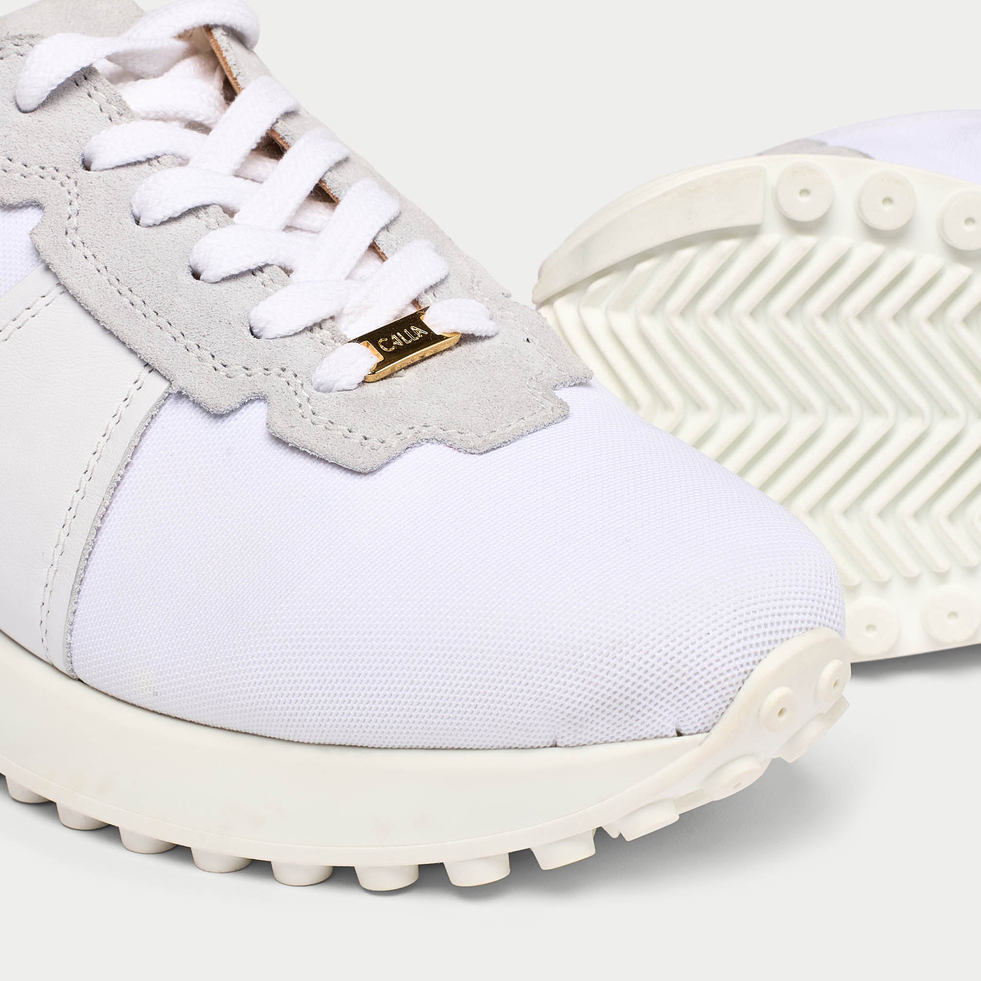 Cosmos white trainers tip view
