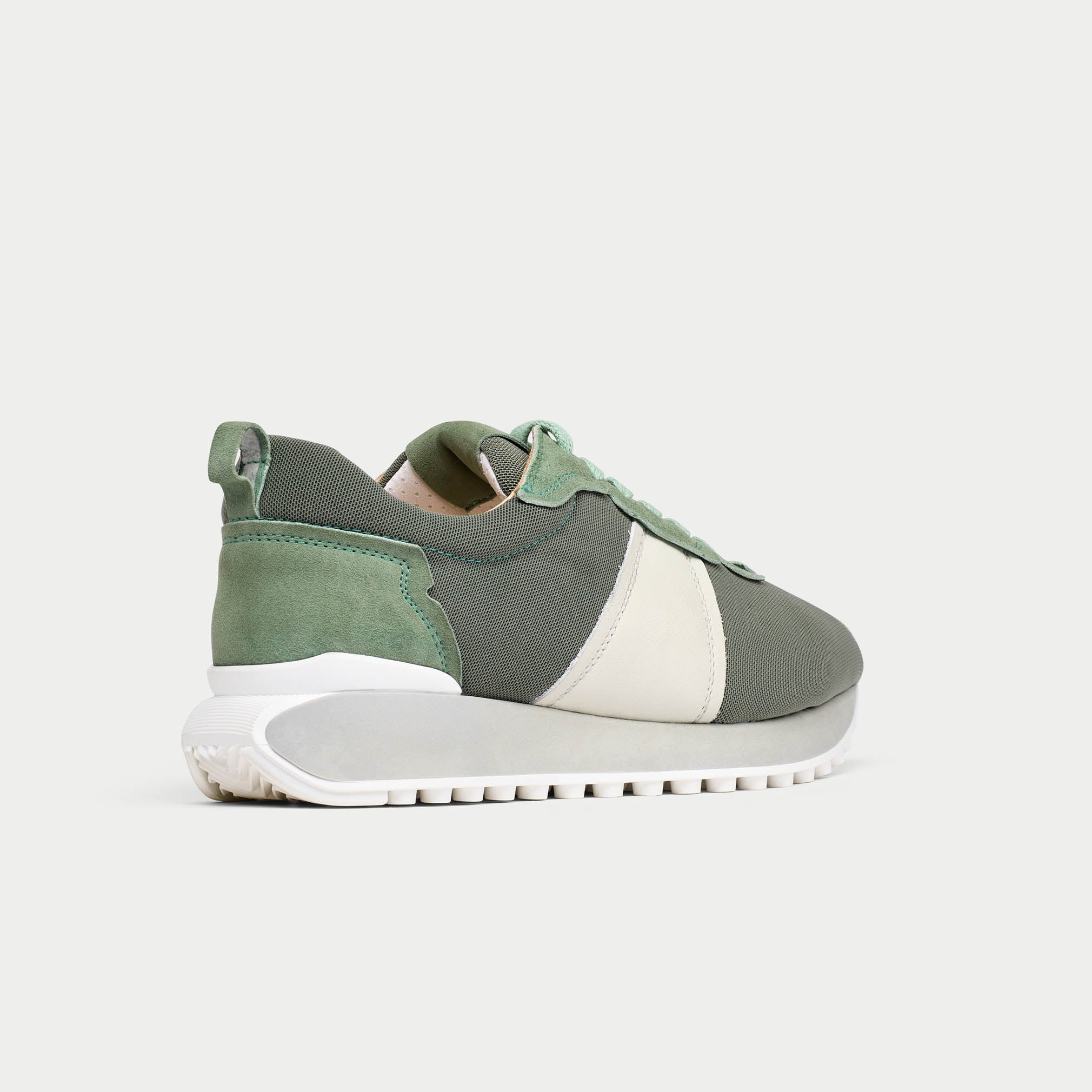 cosmos mist sneaker with white sole on a light gray background back/side view