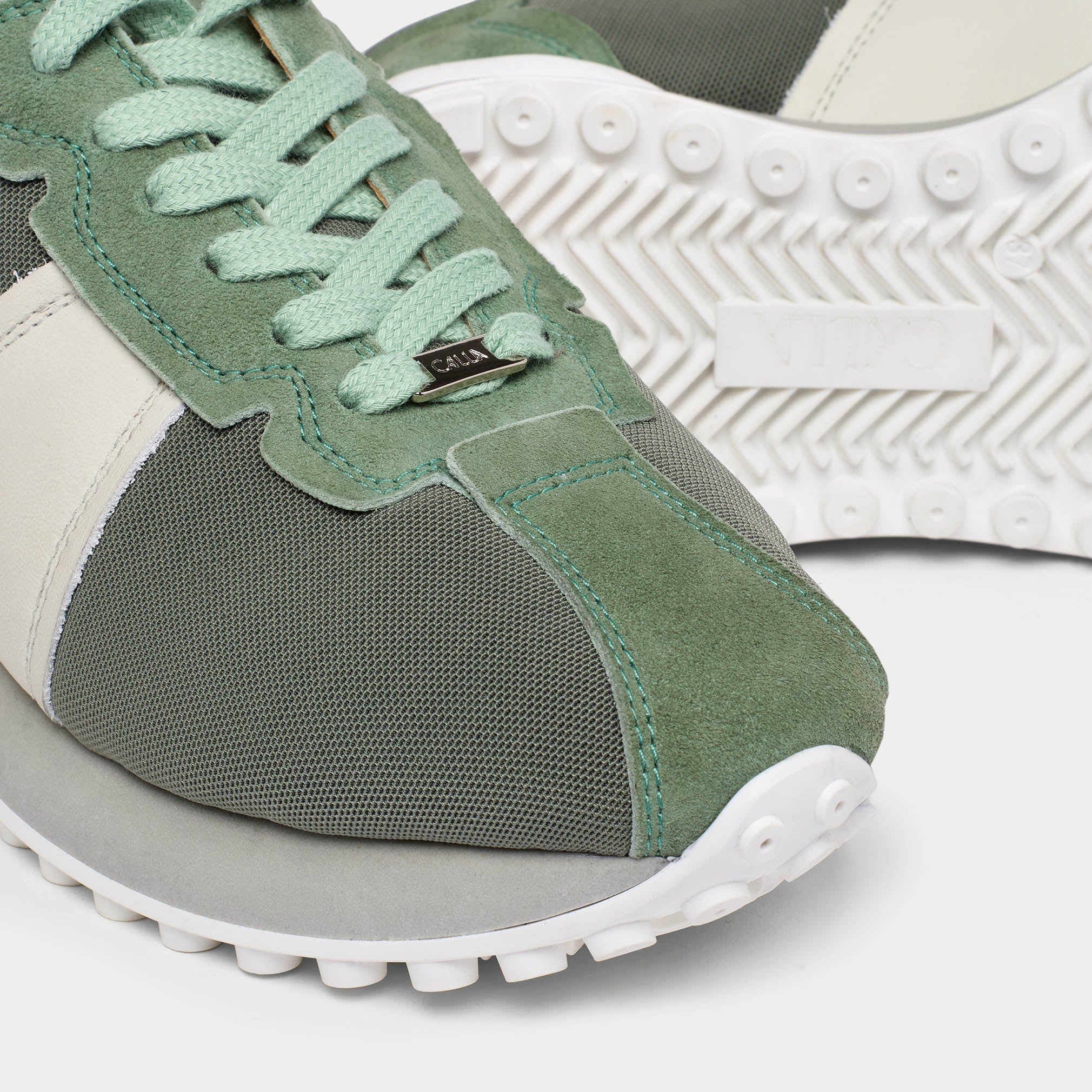 cosmos mist sneaker with white sole on a light gray background tip close-up