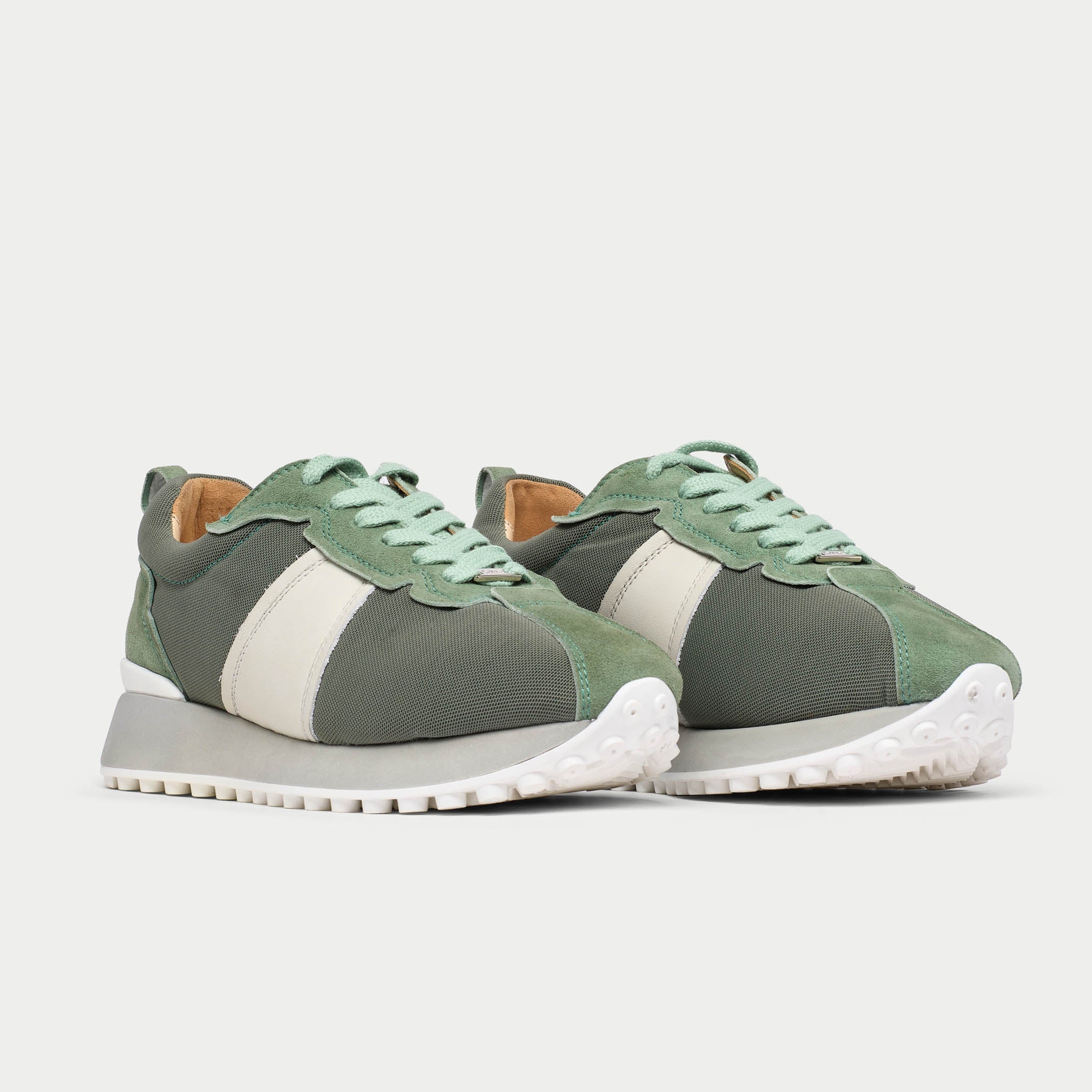 Pair of cosmos mist sneakers on a white background