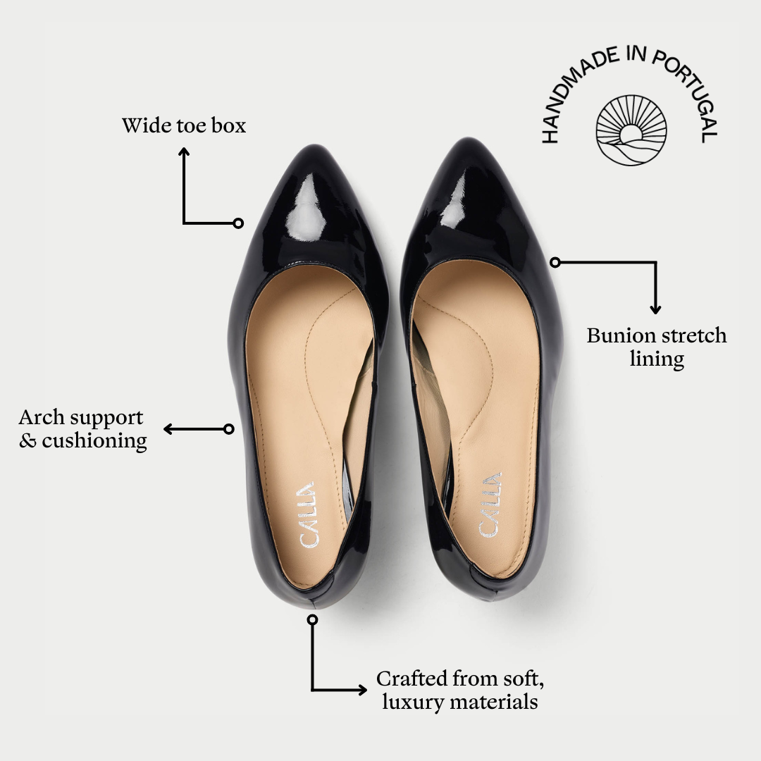 Black patent leather shoes with features highlighted on a white background