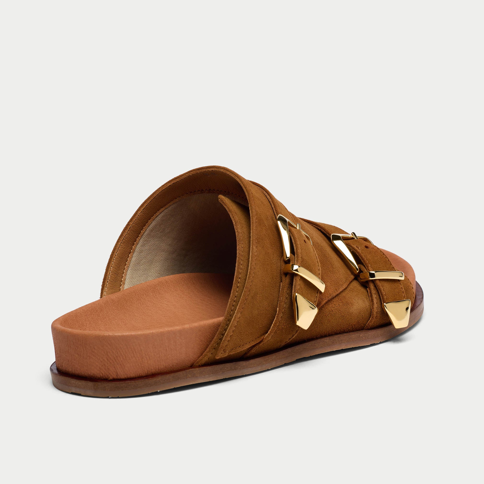 close up of inside tan suede bunion sandals