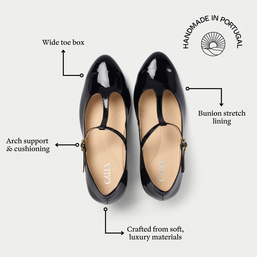 Black patent leather shoes with features highlighted on a white background