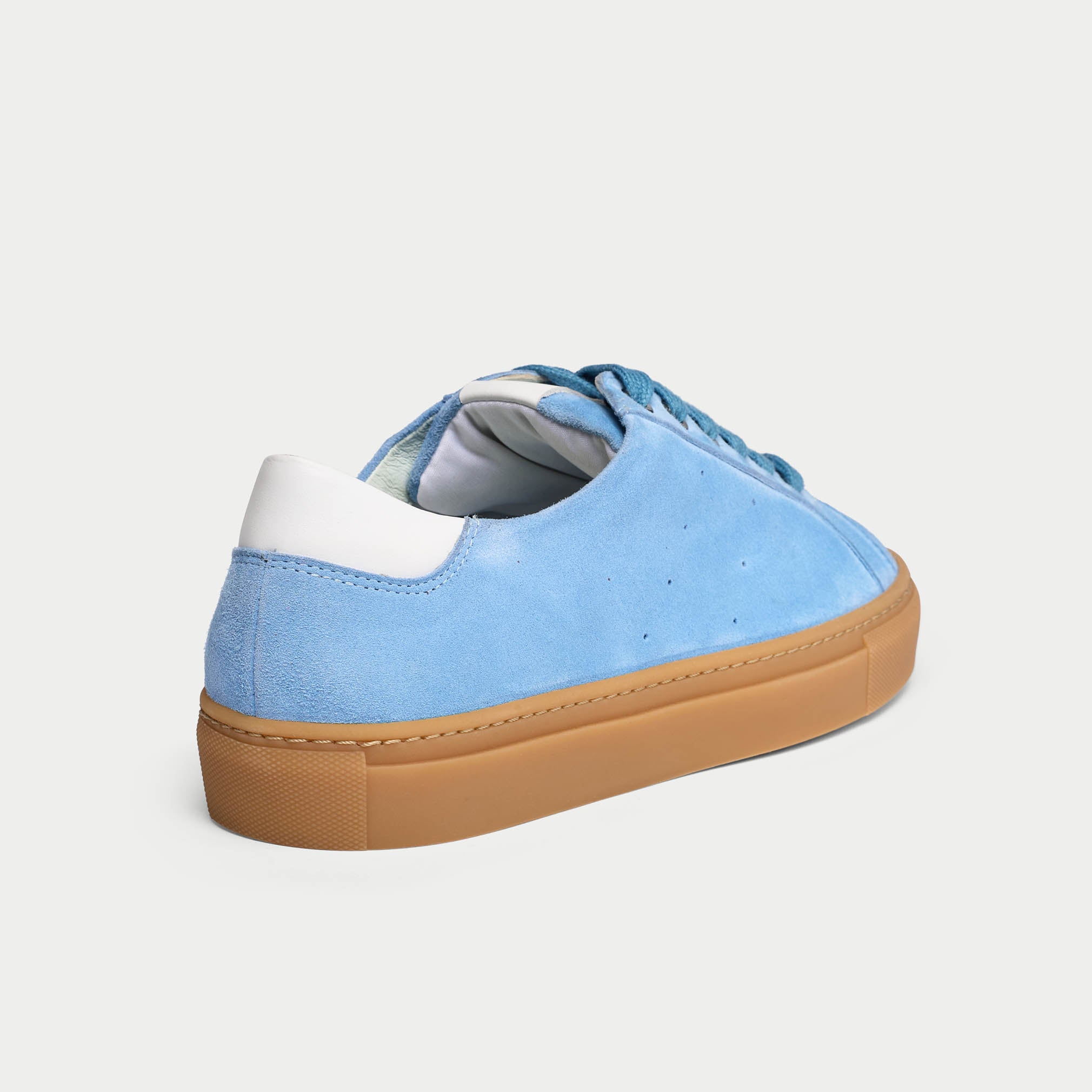 blue suede sneaker heel close up