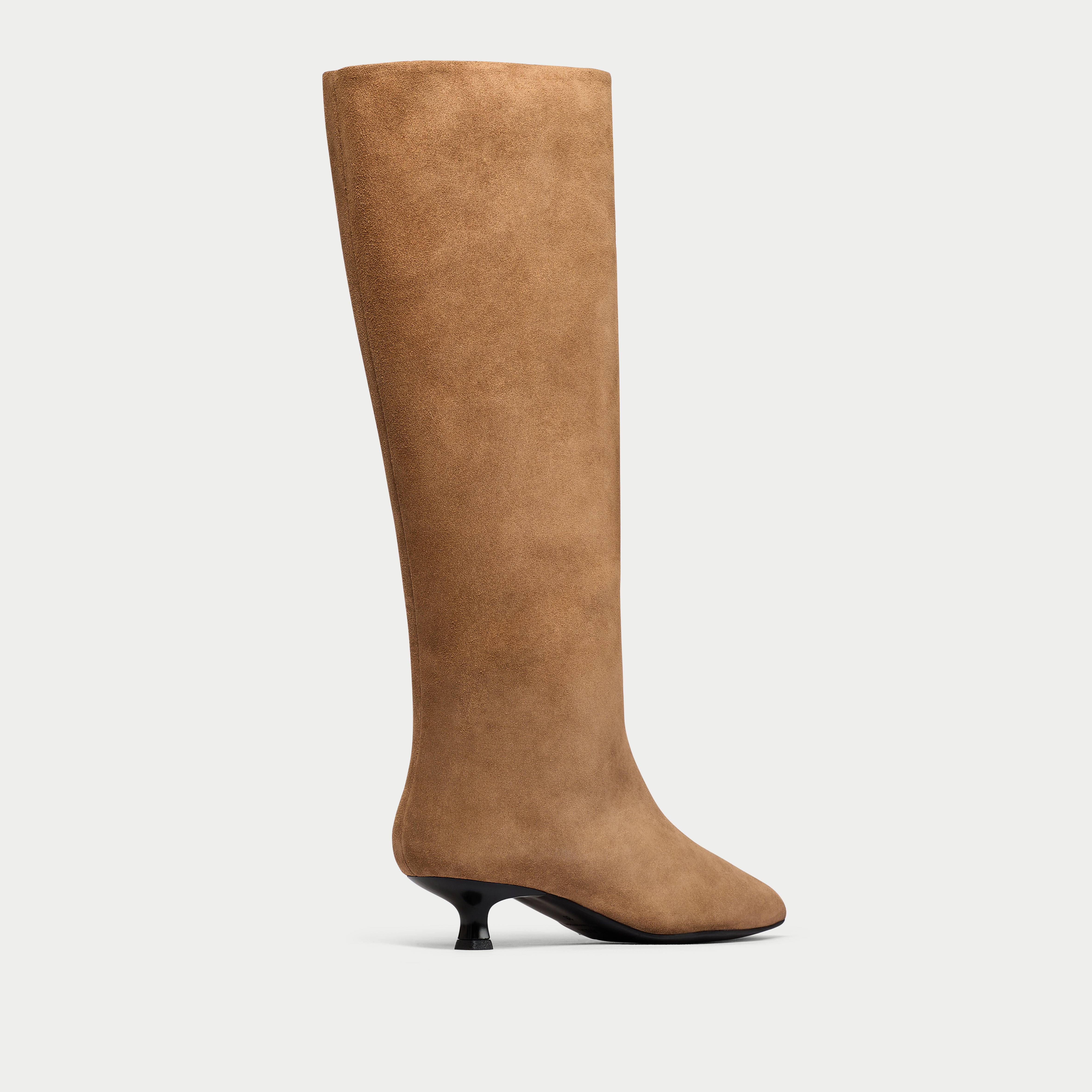 Tan knee-high boot on a light gray background