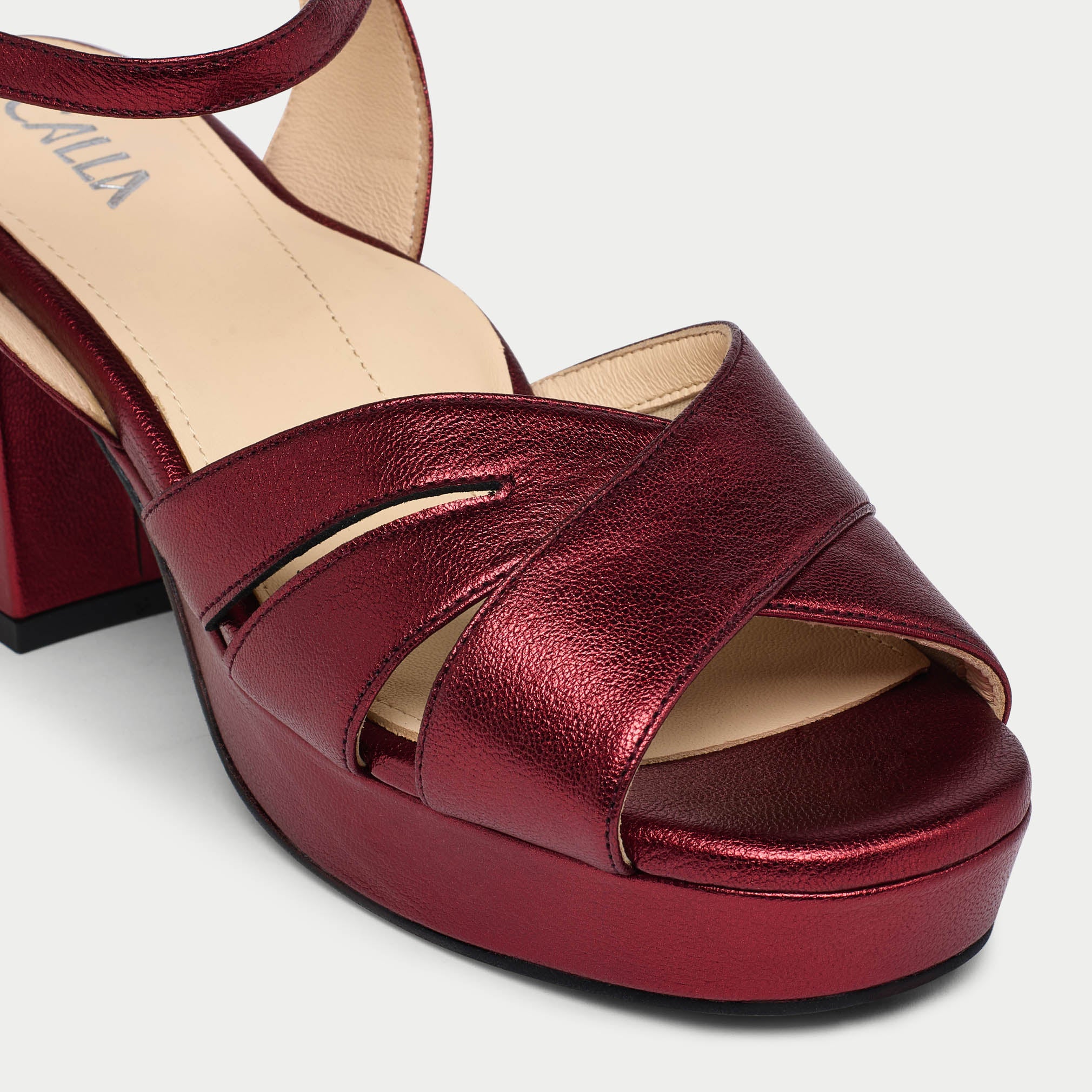 Red platform sandal on a white background