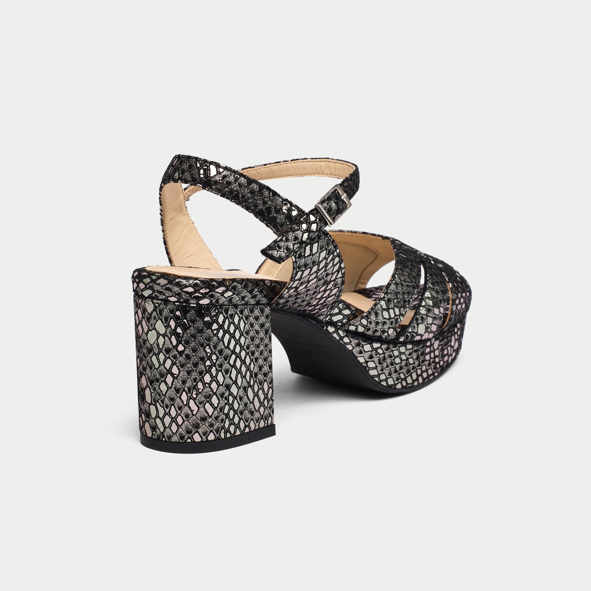 Black and gray patterned high-heeled shoes on a light gray background