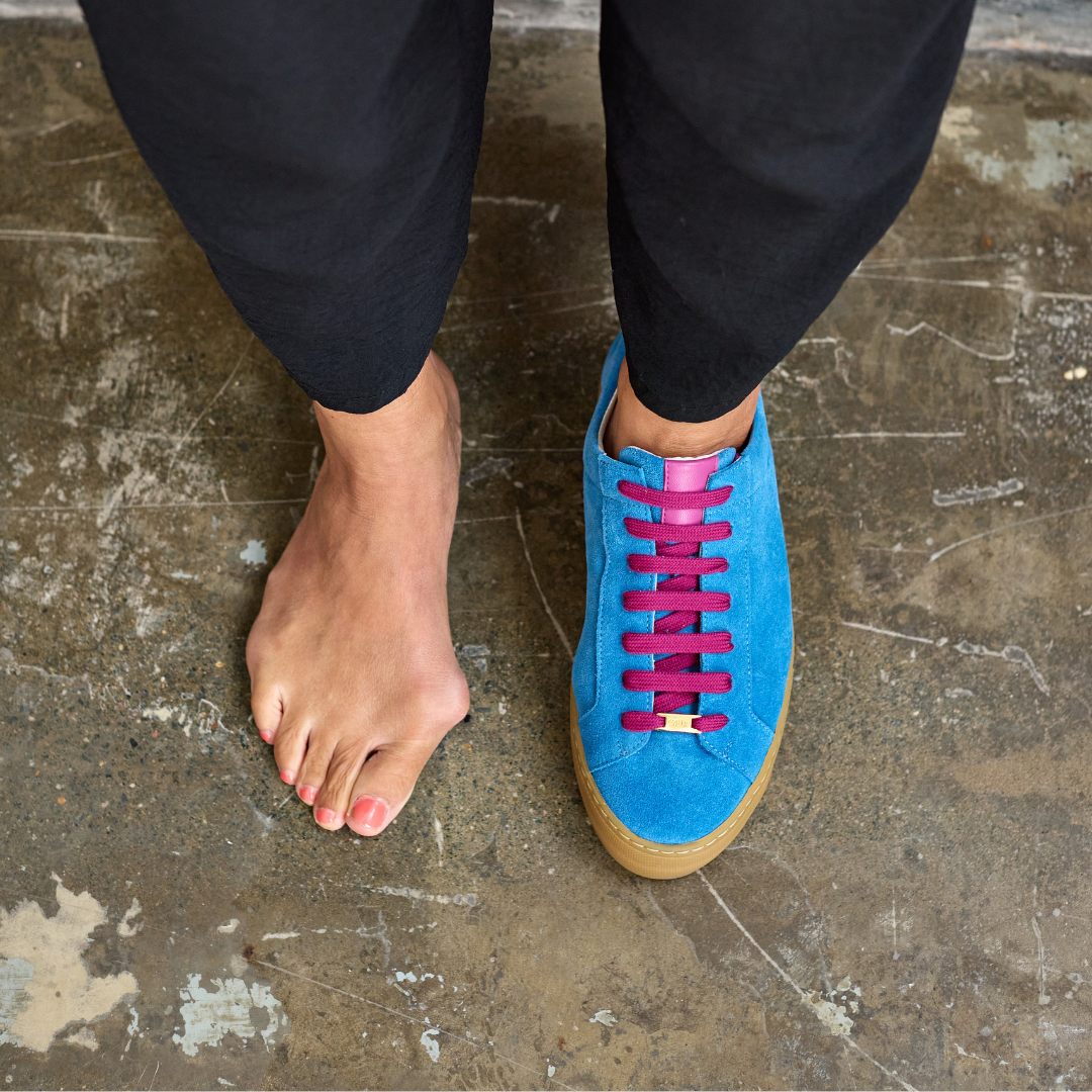 saturn blue sneakers on feet top view