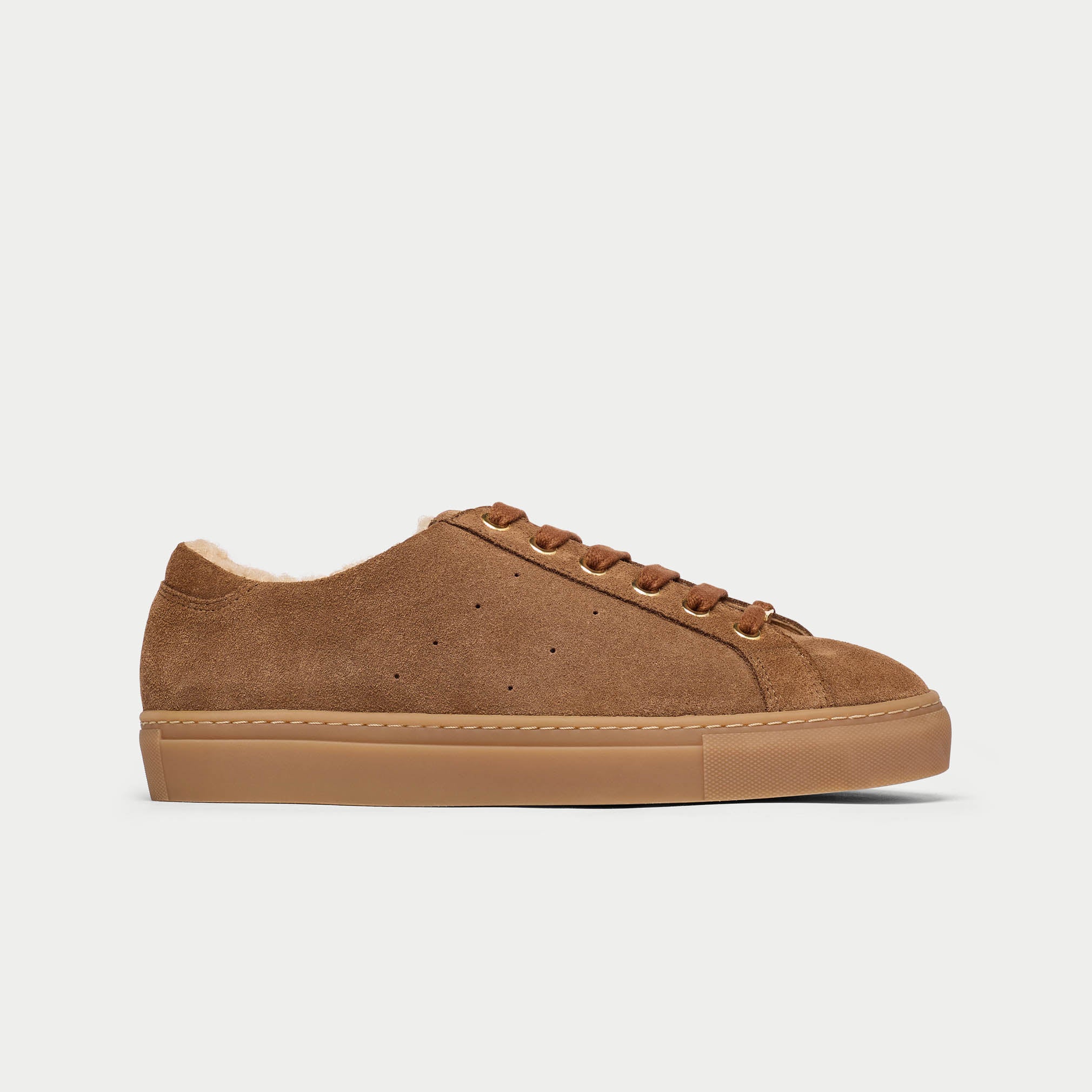 Brown suede sneaker on a light gray background
