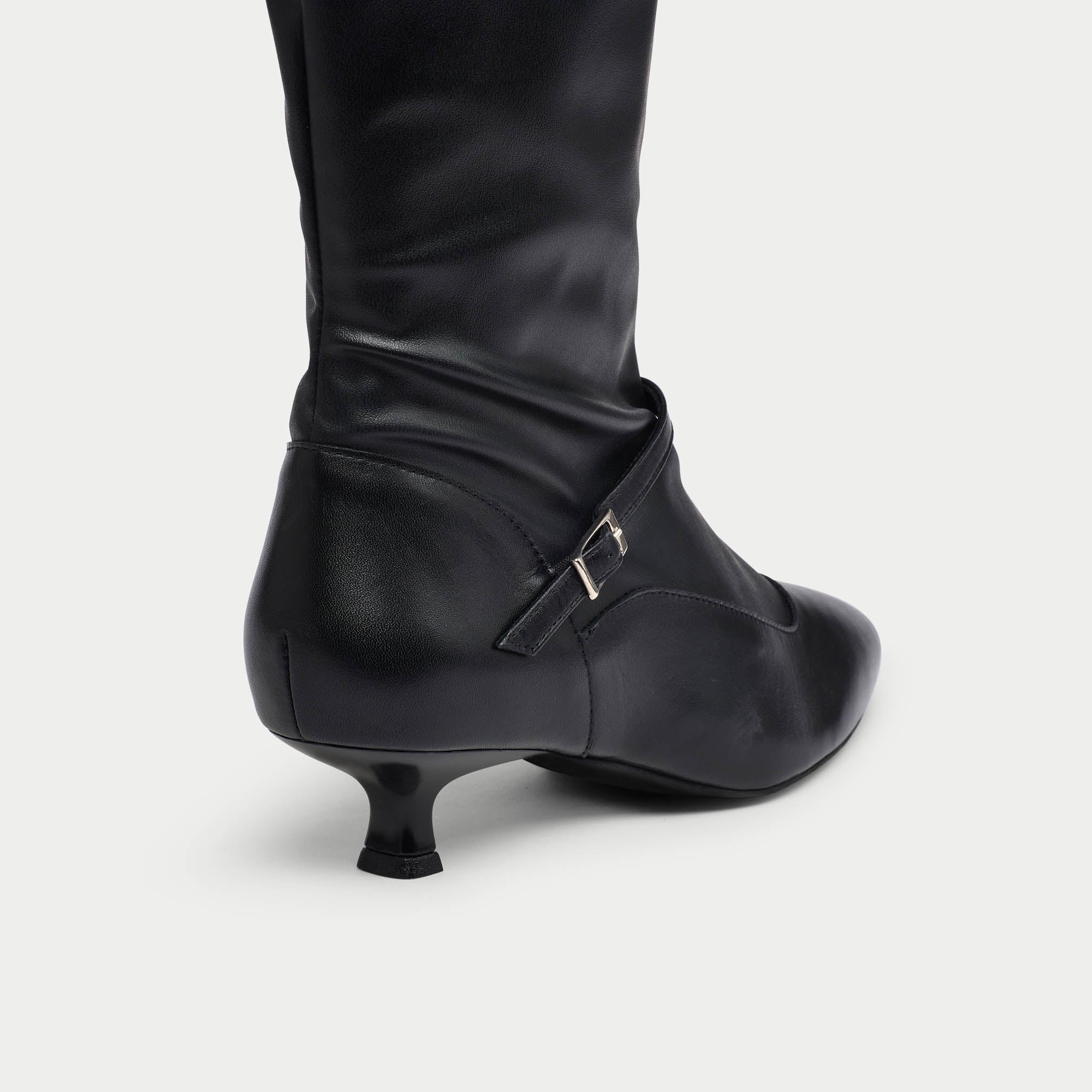 Black Veronica leather boot with a small heel on a light gray background