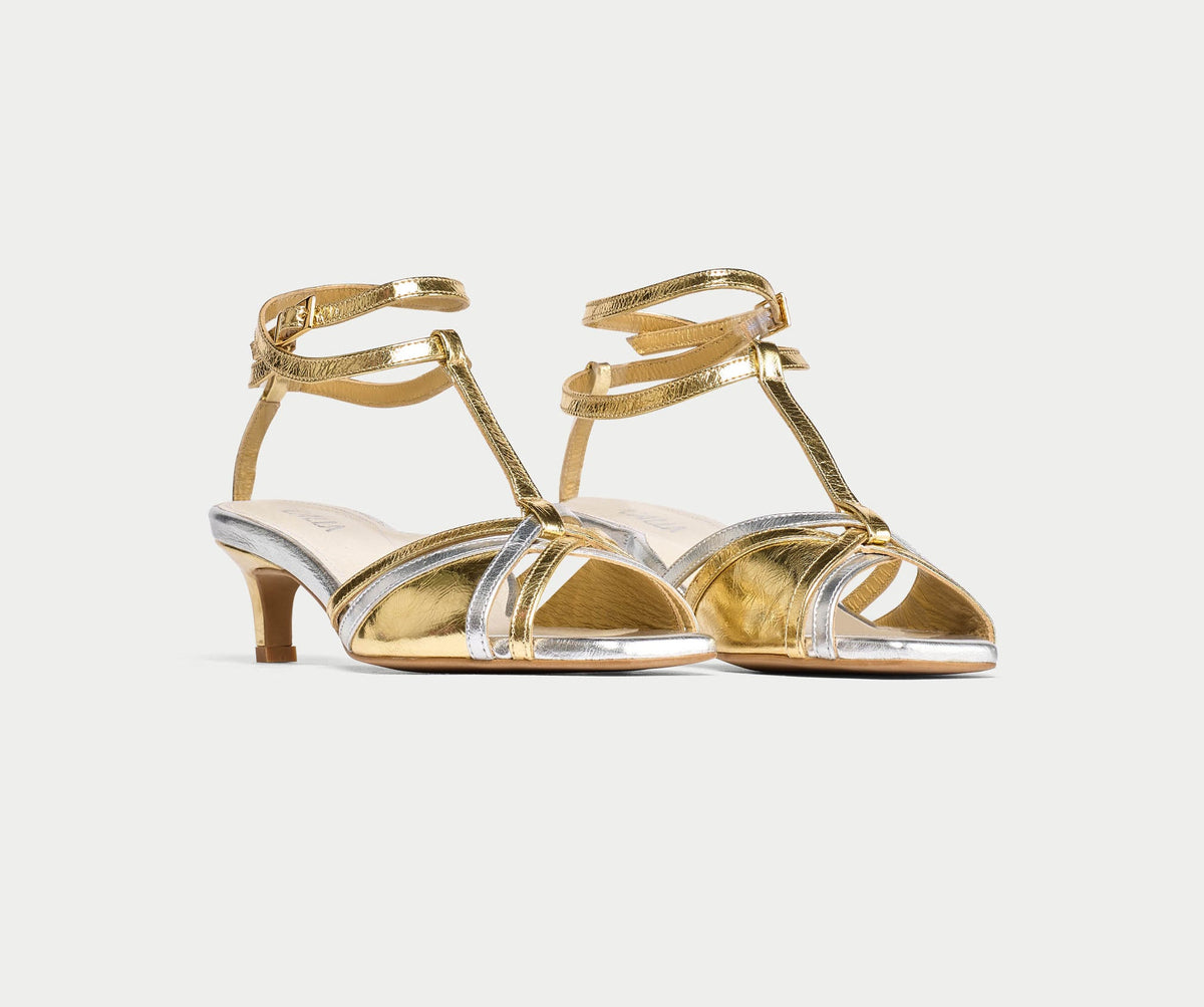 A pair of Calla Ria kitten heel sandals in mixed gold and silver metallic leather