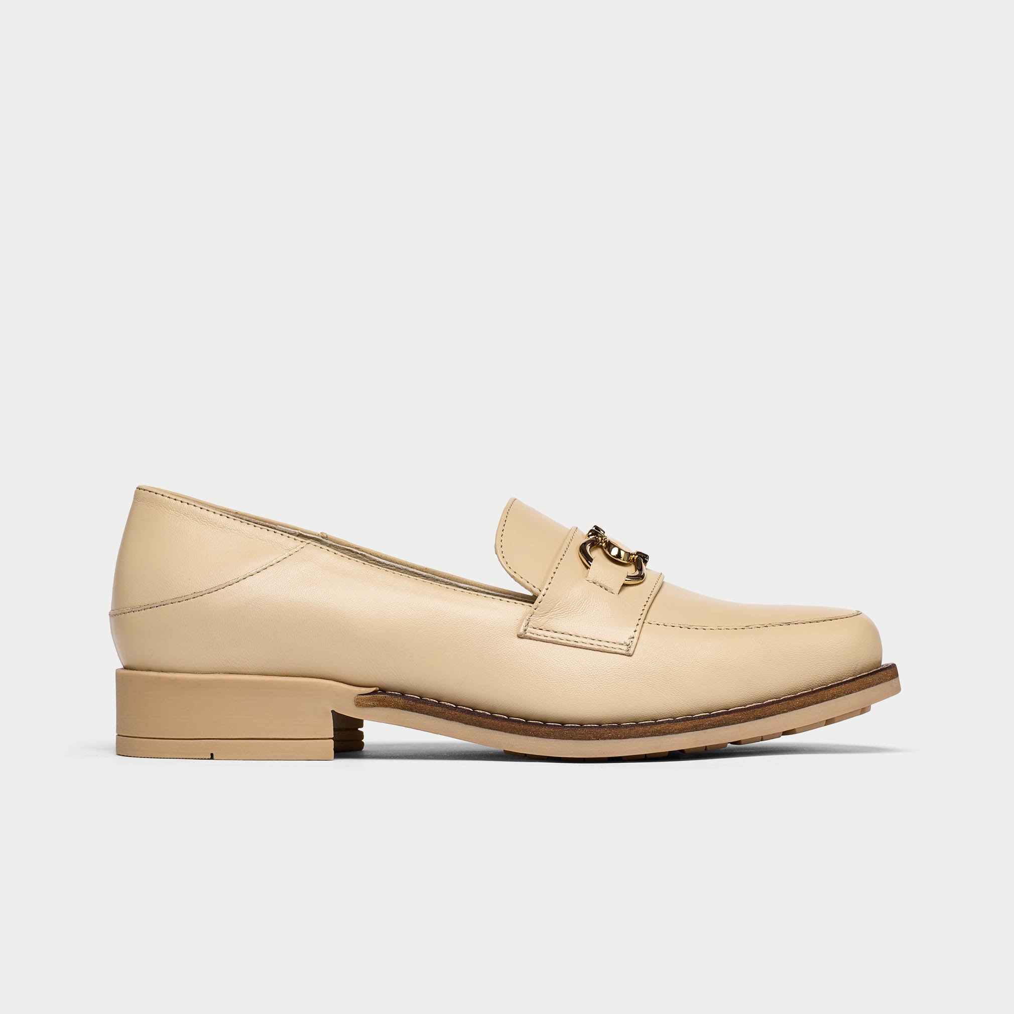 Beige loafer shoe on a white background