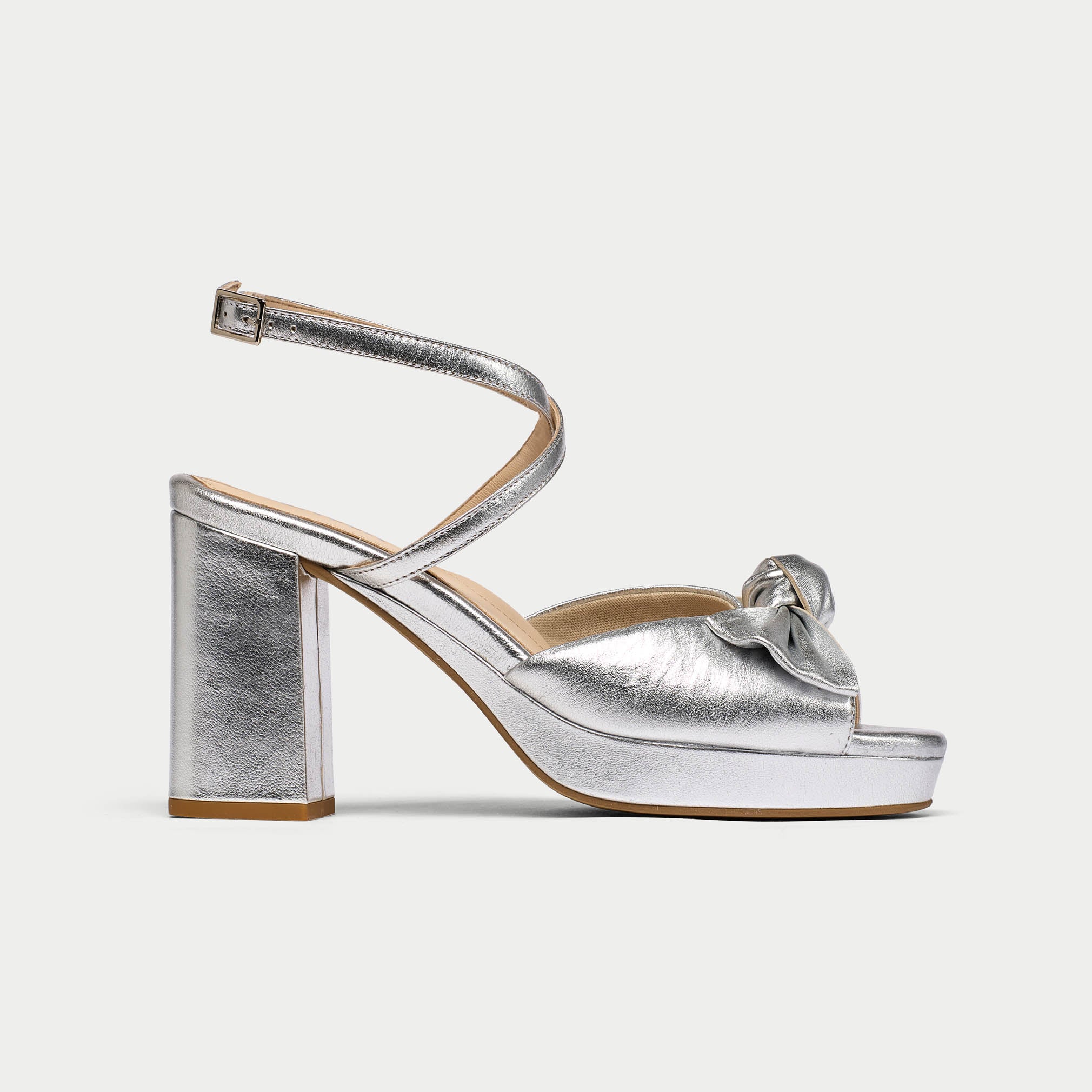 Silver high-heeled sandal on a white background