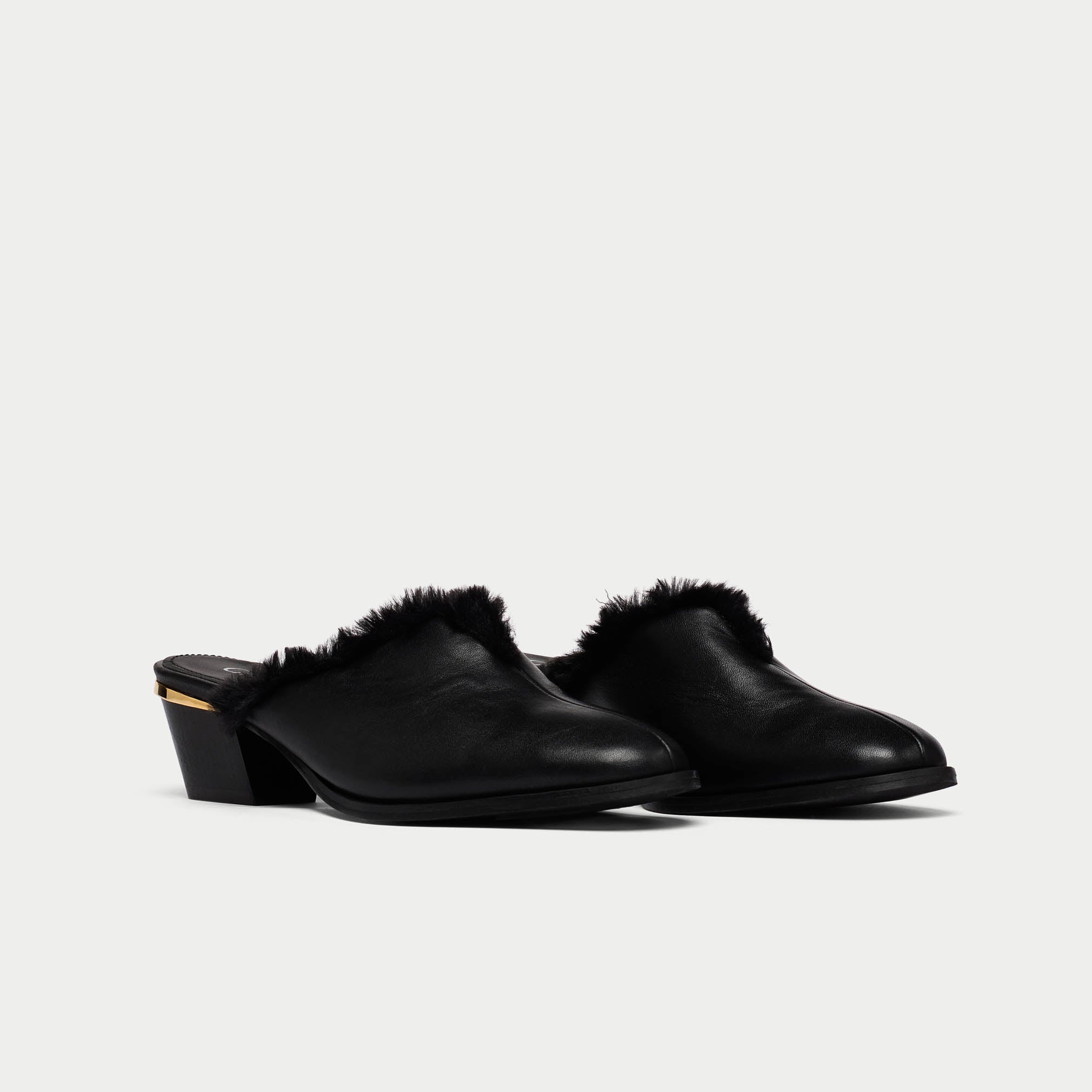 Eden black leather and fur mules pair