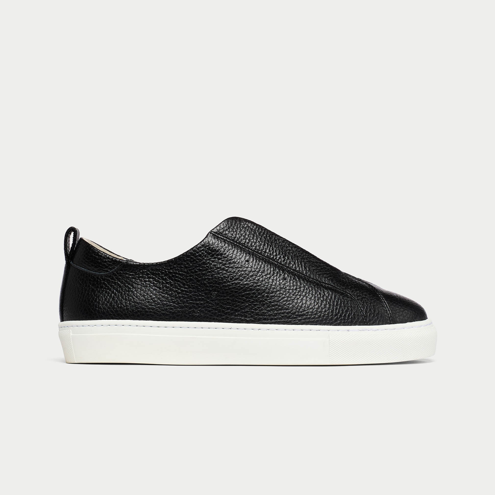 Black leather slip-on sneaker on a light gray background