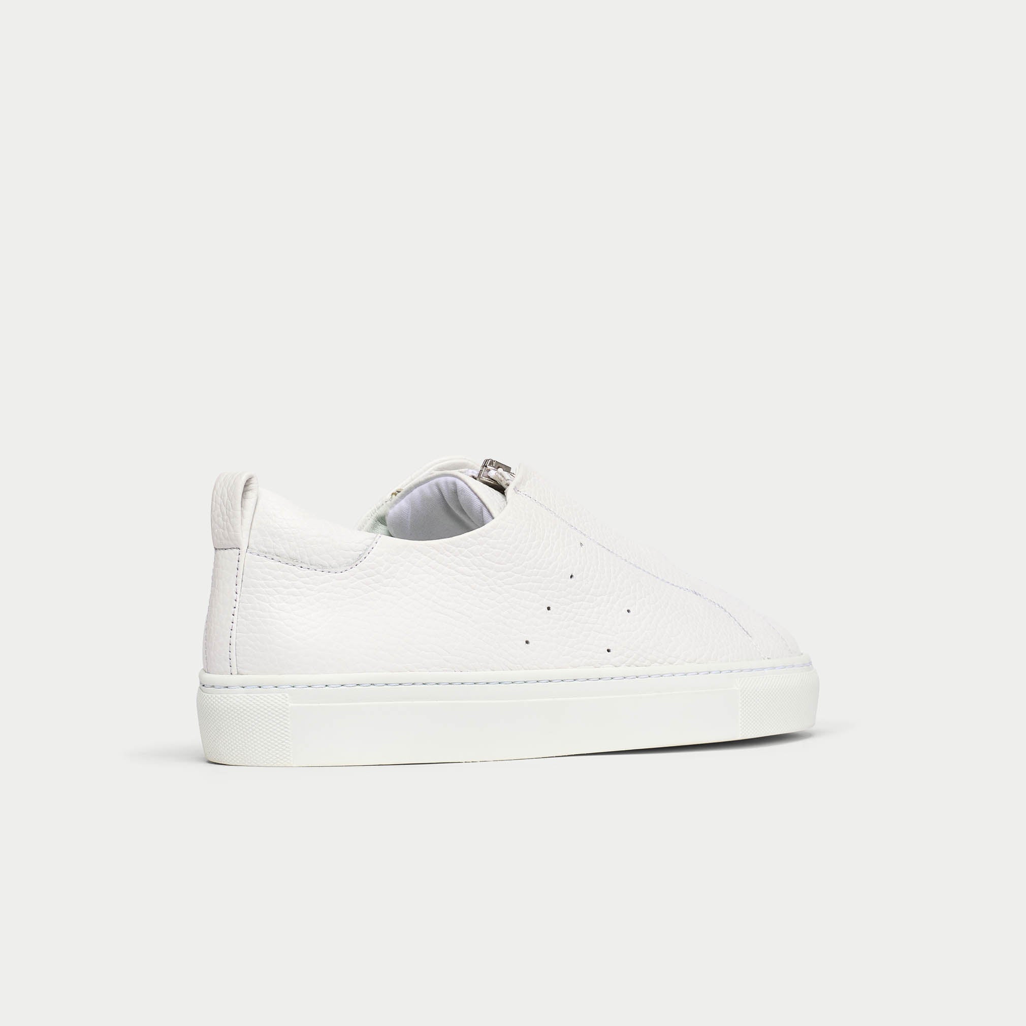 Estella white sneakers back/side view