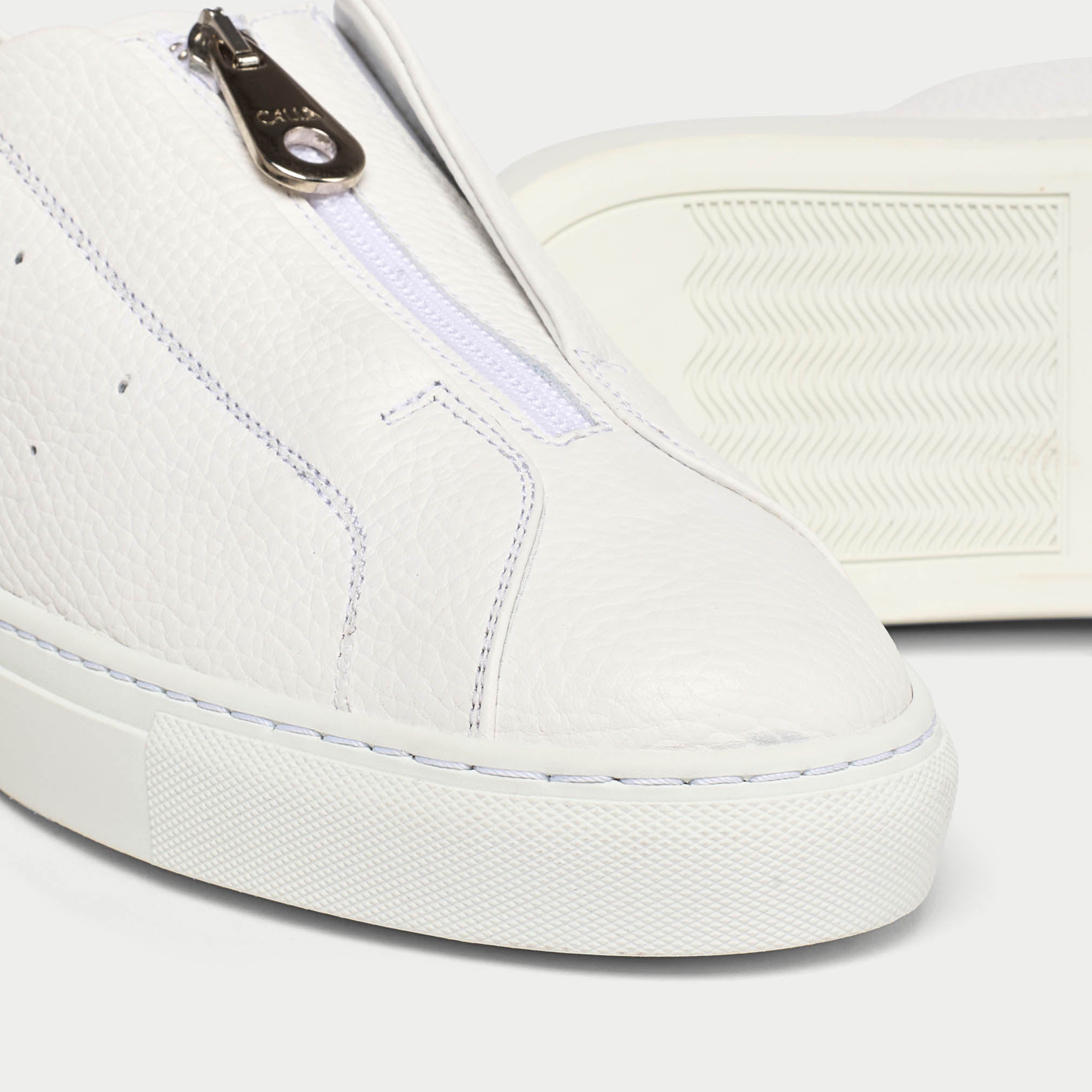 Estella white sneakers tip close up