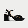 Black platform sandal on a light gray background