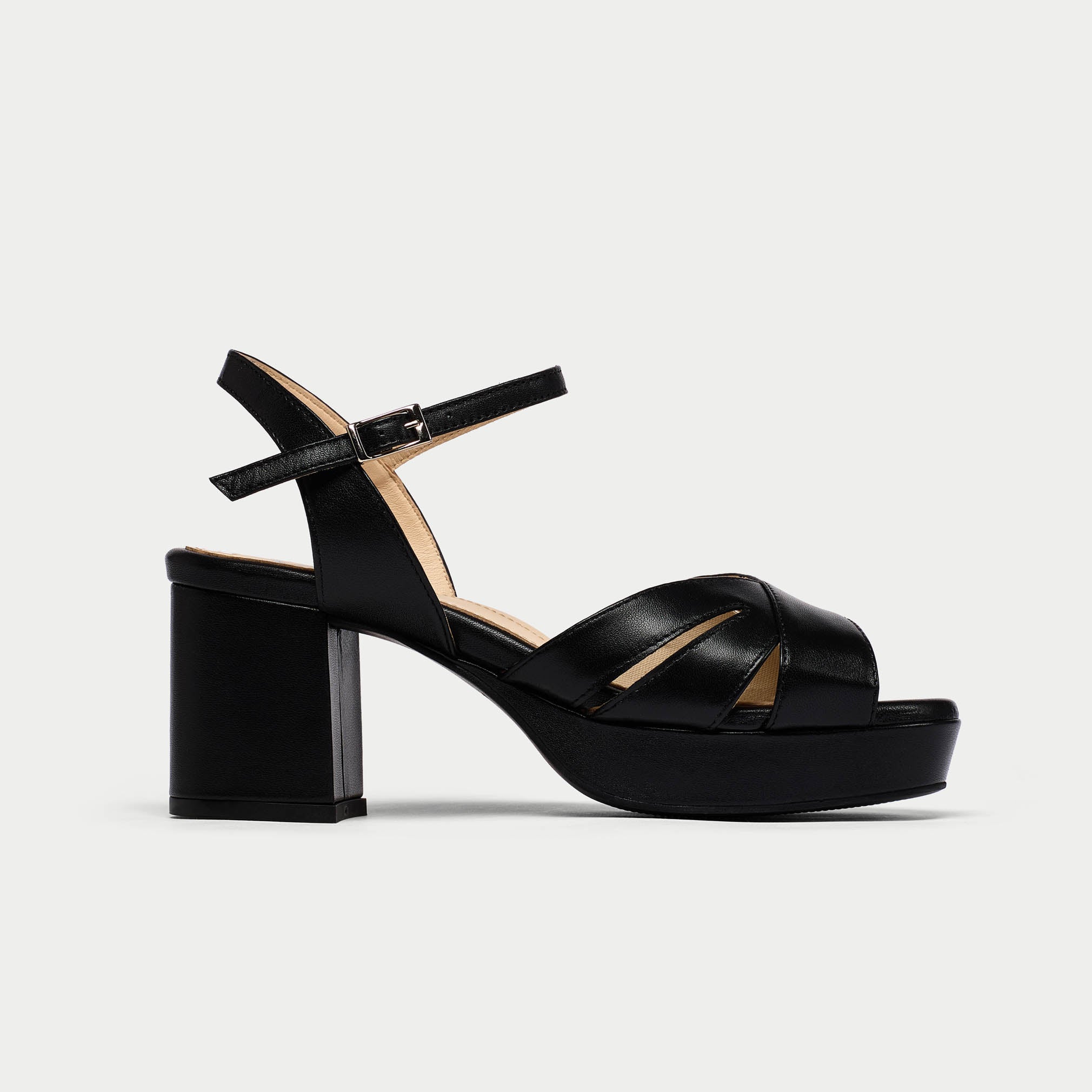 Black platform sandal on a light gray background
