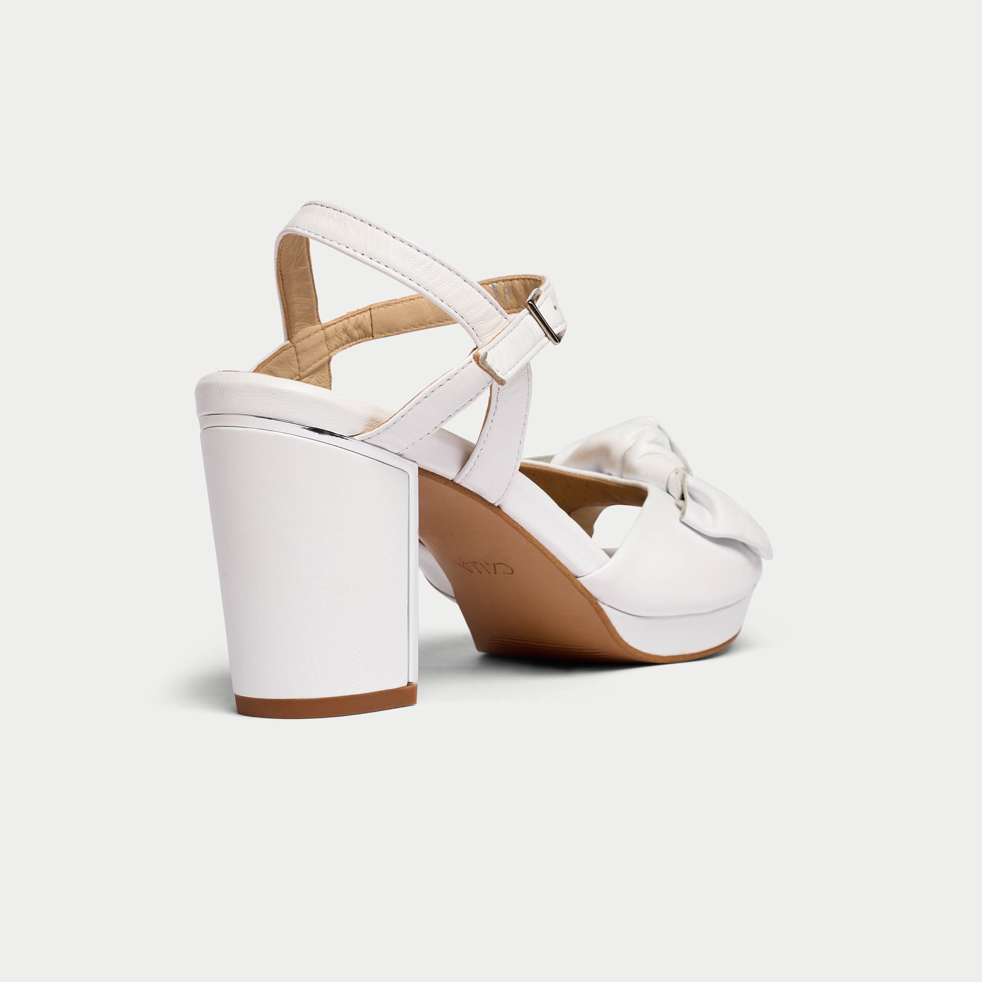 Lizzie white sandal heel back/side view