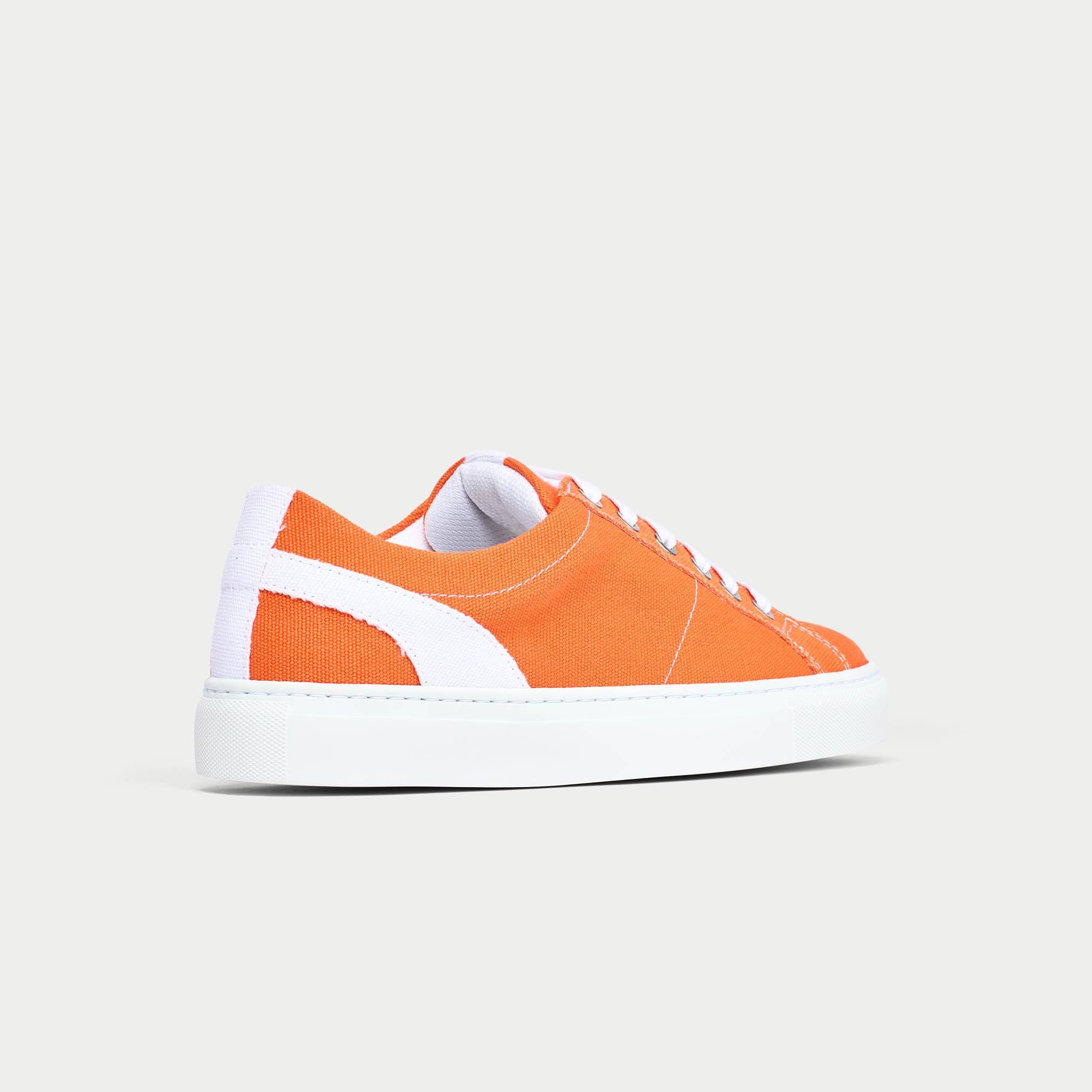 Luna orange trainer shoe back/side view