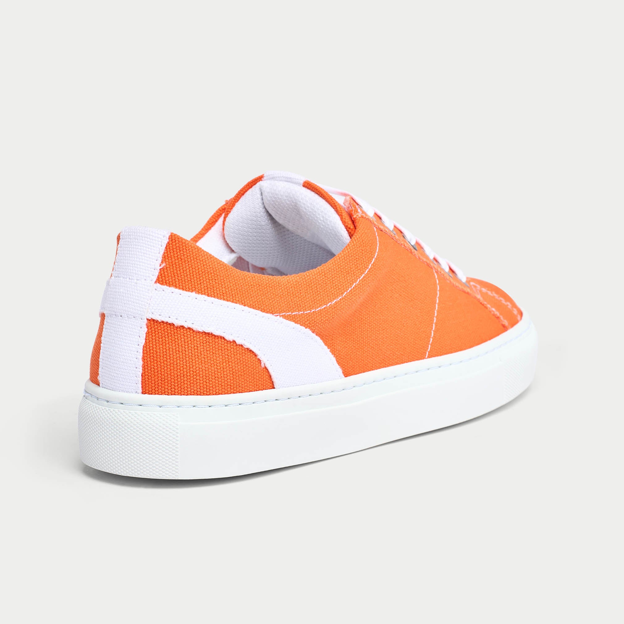 Luna orange trainer shoe back view