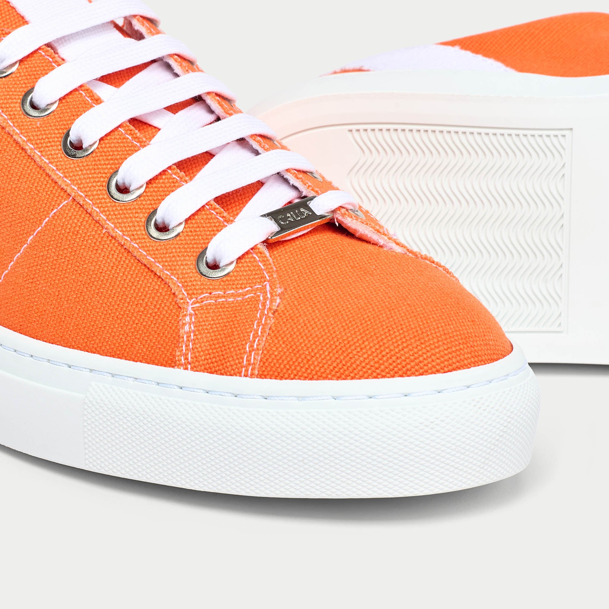 Luna orange trainer shoe tip close up