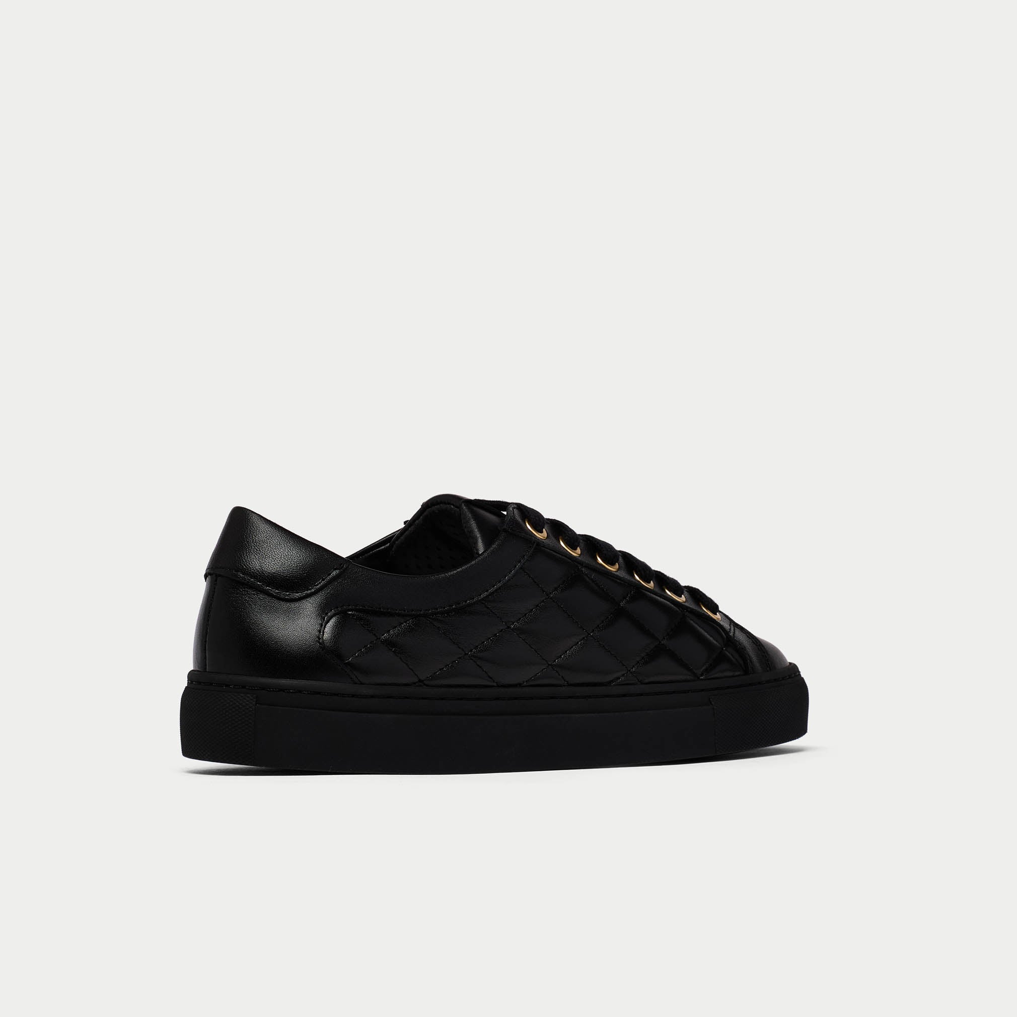 star black quilted sneakers back/side view