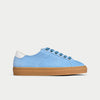 Blue sneaker with a brown sole on a white background