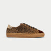 Leopard print sneaker with brown sole on a light gray background