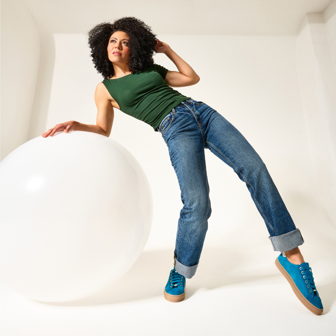 Star teal sneakers look on model