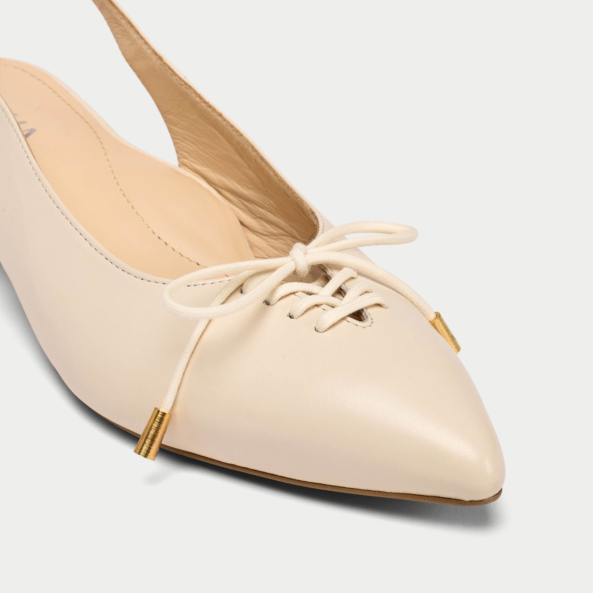 Trudie neutral slingback shoe tip close up