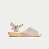 Woven sandal with a strap on a light gray background