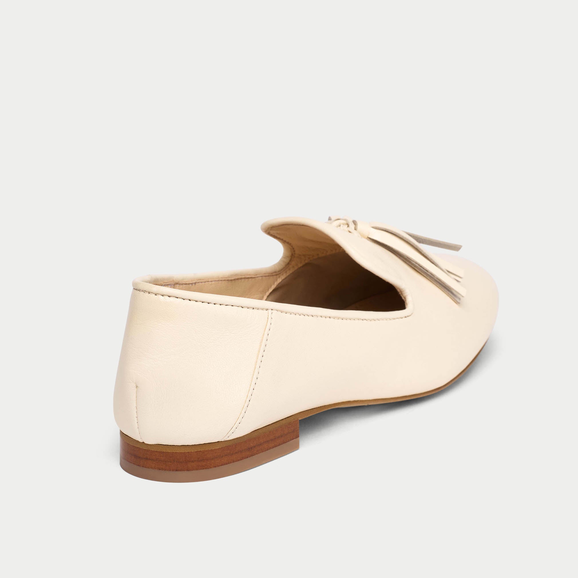 Beige loafer shoe on a light gray background