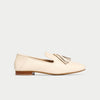Beige loafer shoe on a light gray background