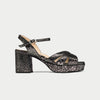 Black patterned sandal on a light gray background
