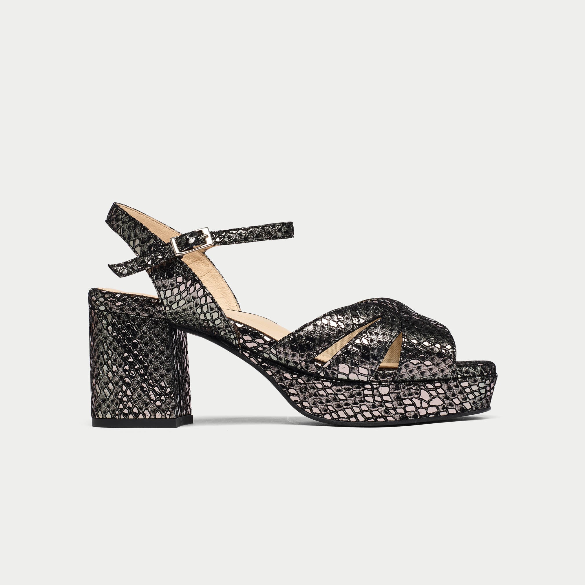 Black patterned sandal on a light gray background