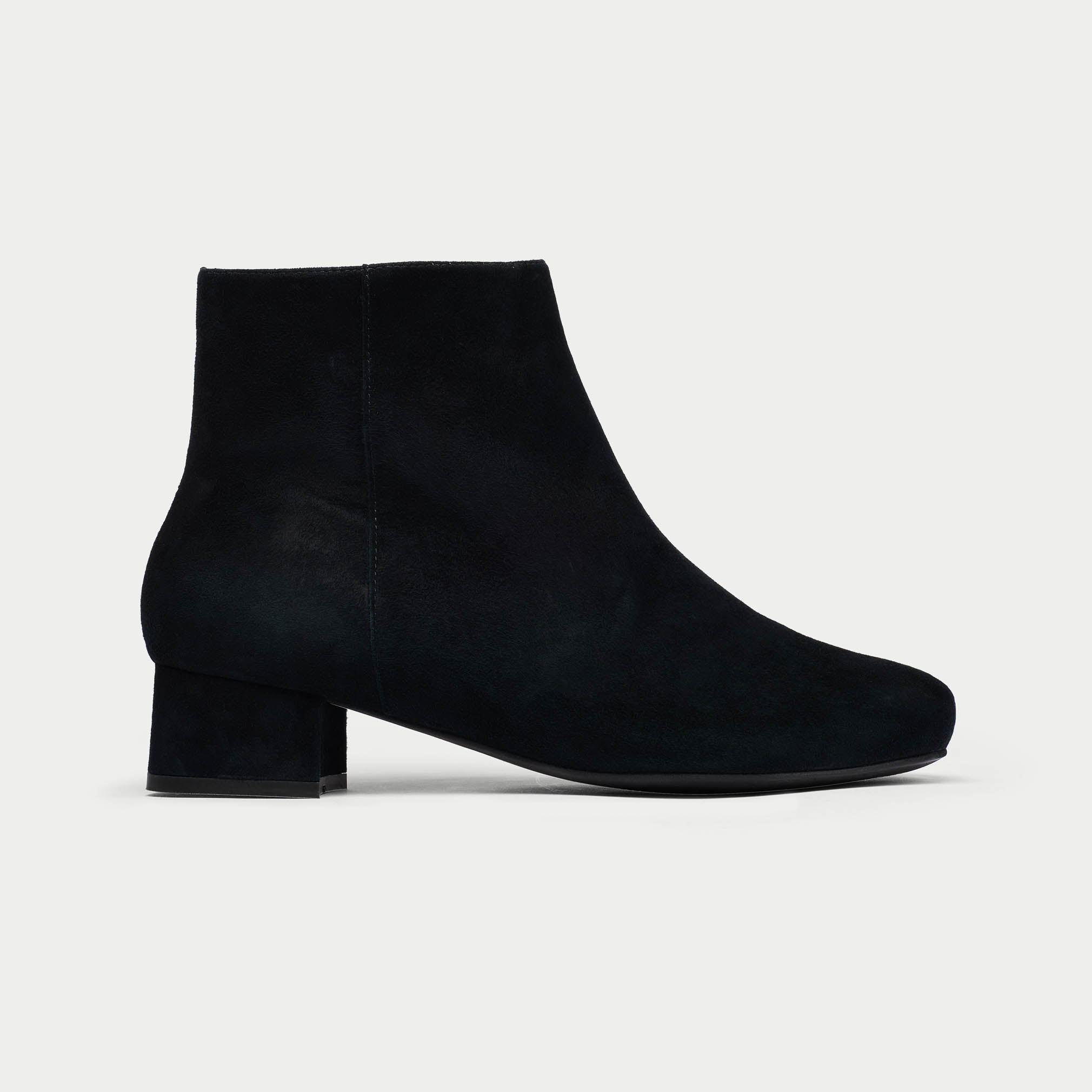 Black ankle boot on a white background
