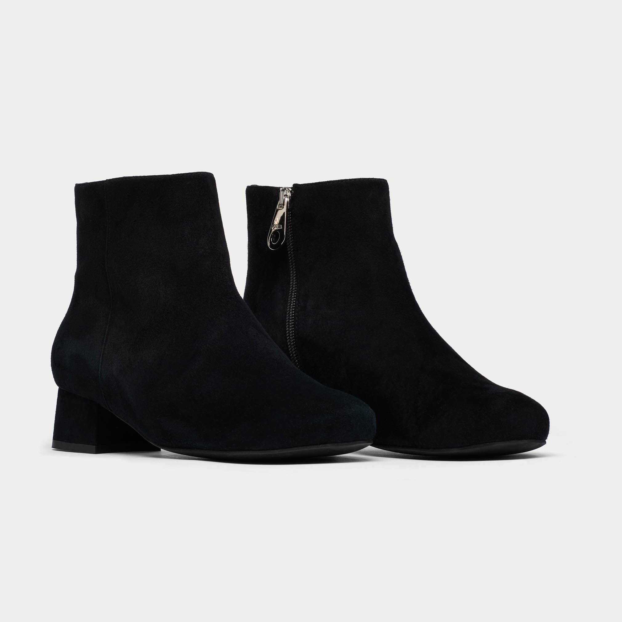 Pair of Lexie black ankle boots on a light gray background