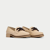 pair of neutral leather loafers 