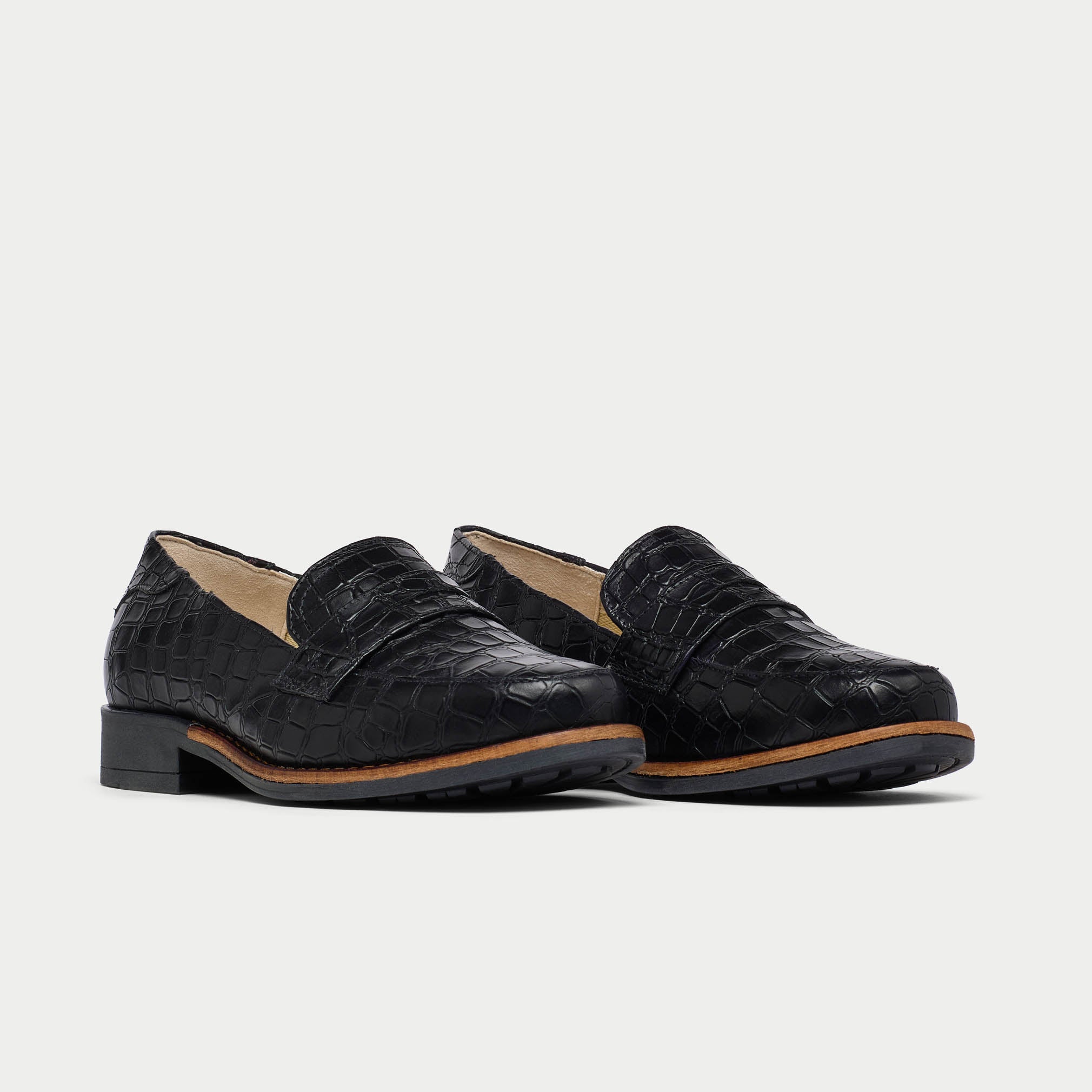 Pair of black Nadia loafers on a white background