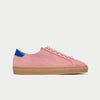 Pink sneaker with a blue heel tab on a light gray background