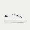 White sneaker with navy accents on a light gray background
