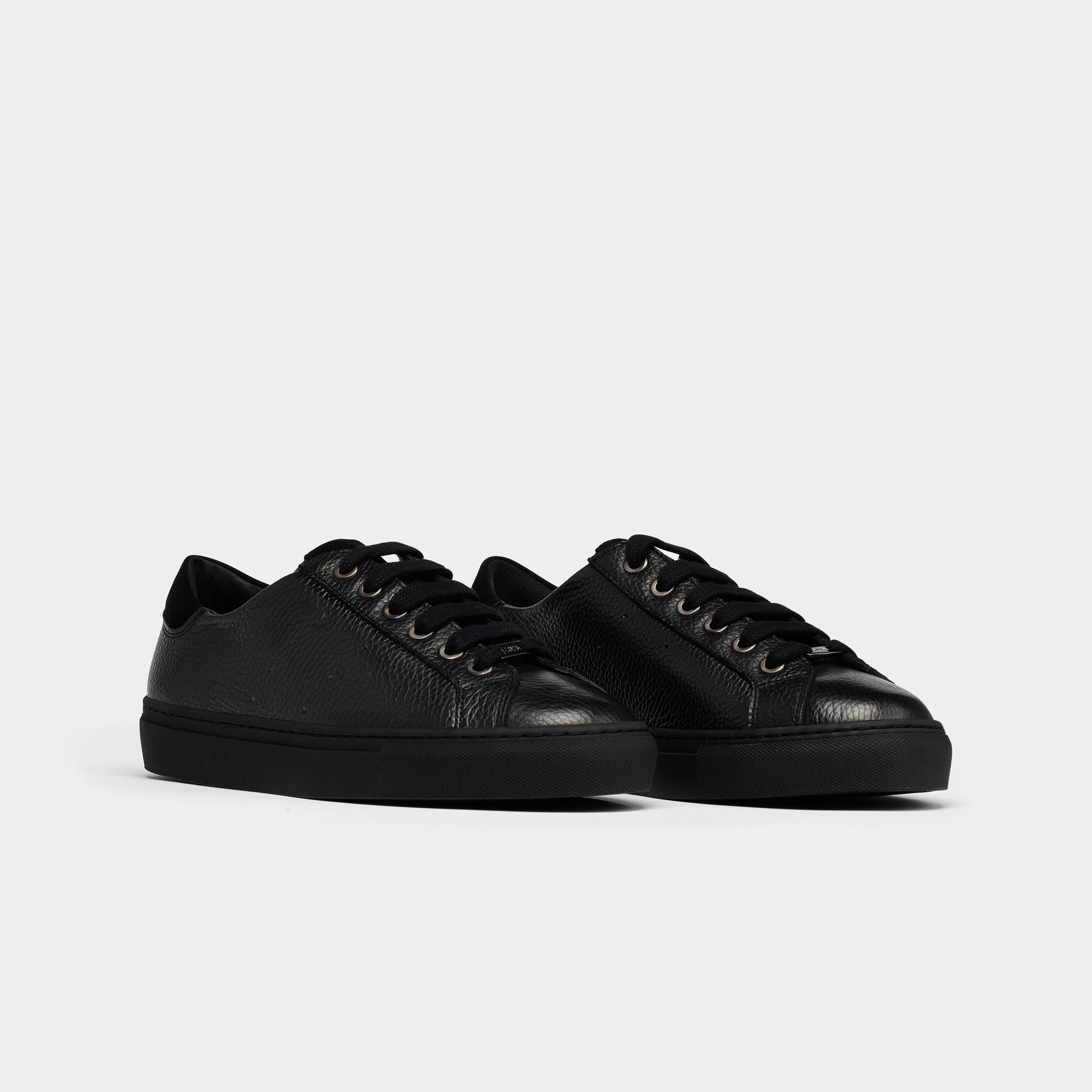 Star black leather sneaker pair