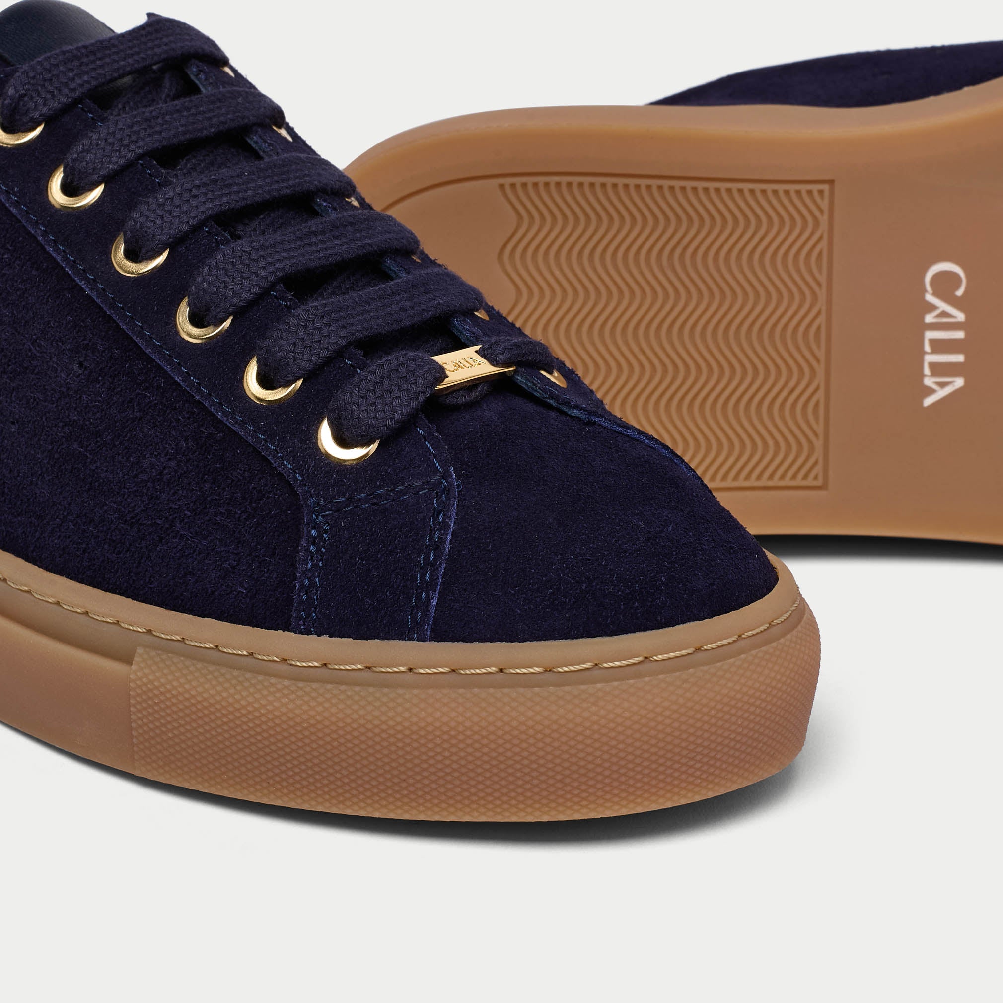 close up of navy suede trainers