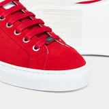 close up red suede trainers