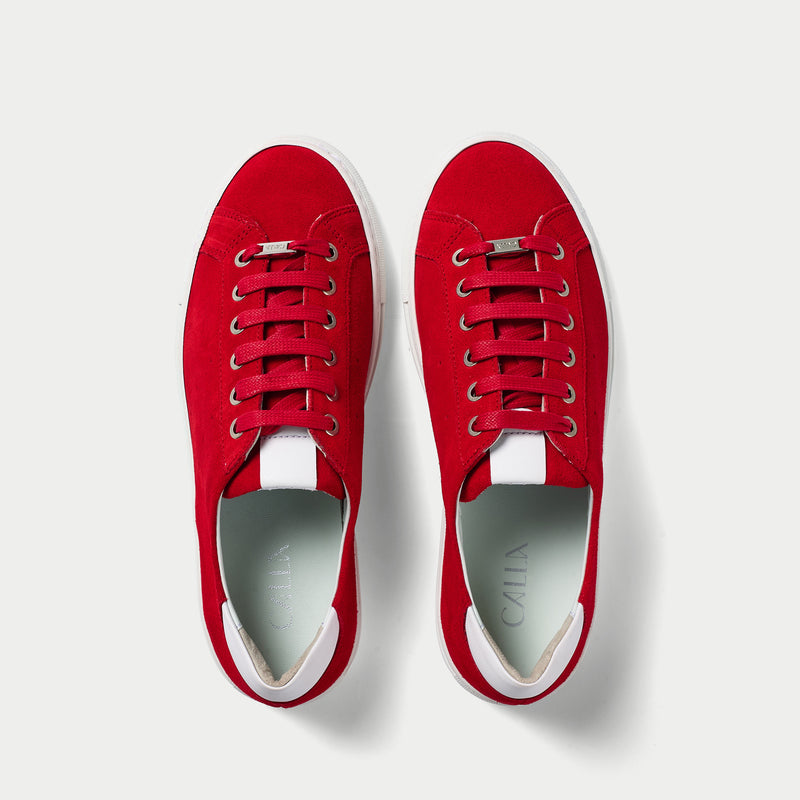 red suede trainers pair