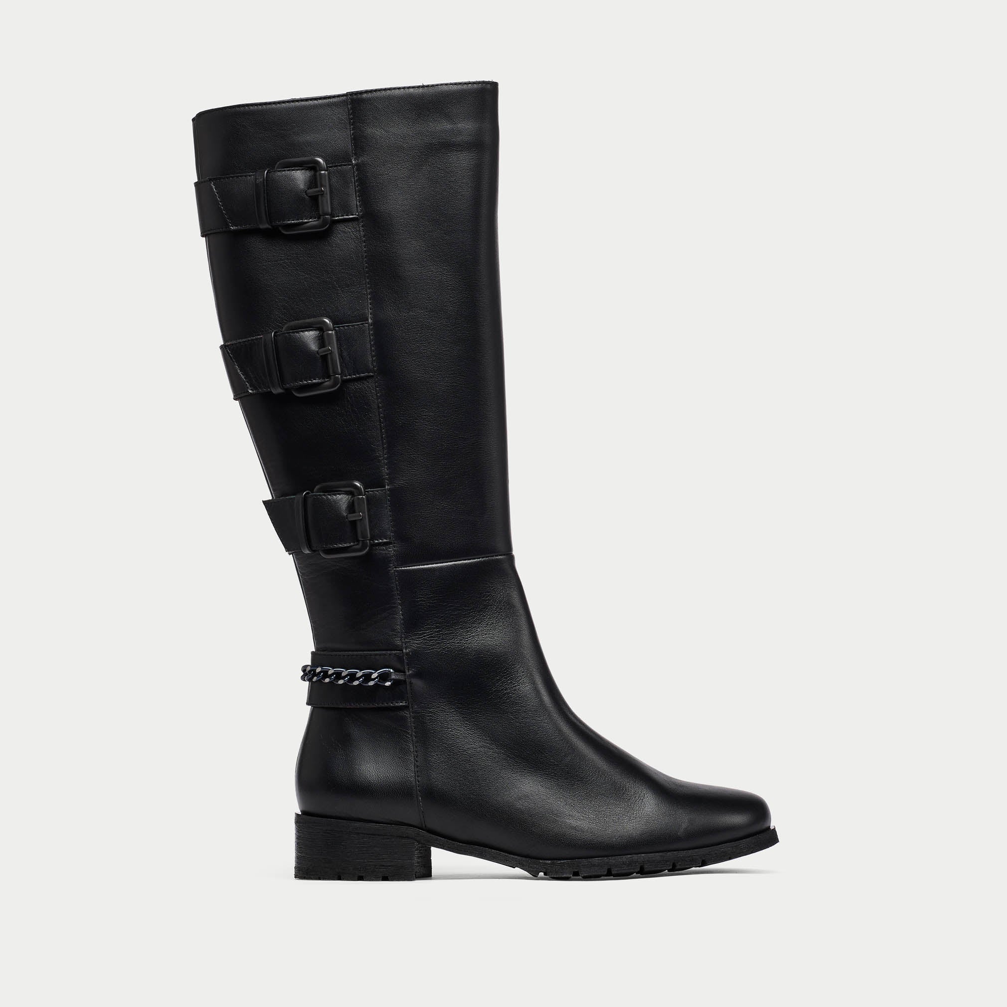 Black knee-high boot with buckles on a light gray background