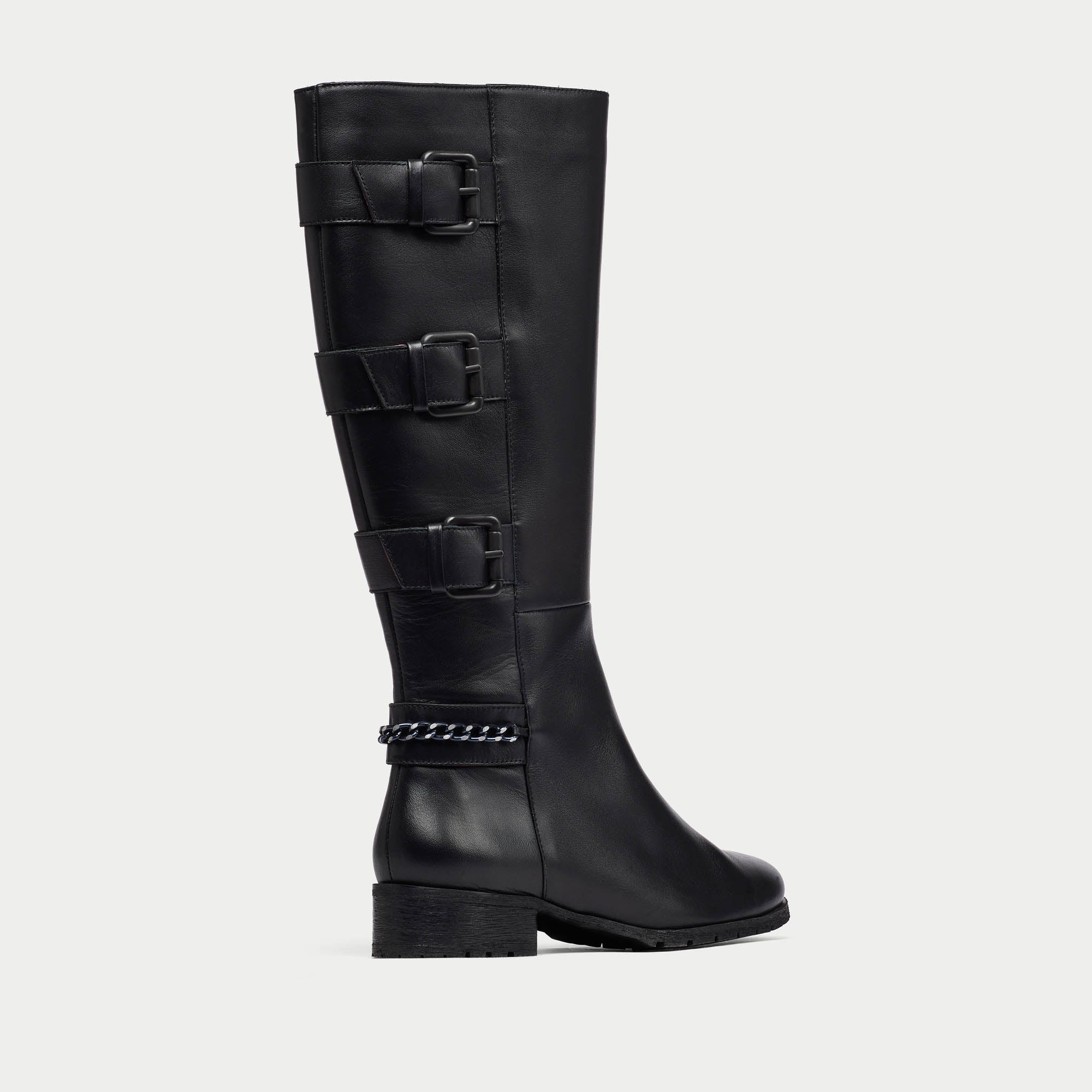 Black knee-high boot with buckles on a light gray background